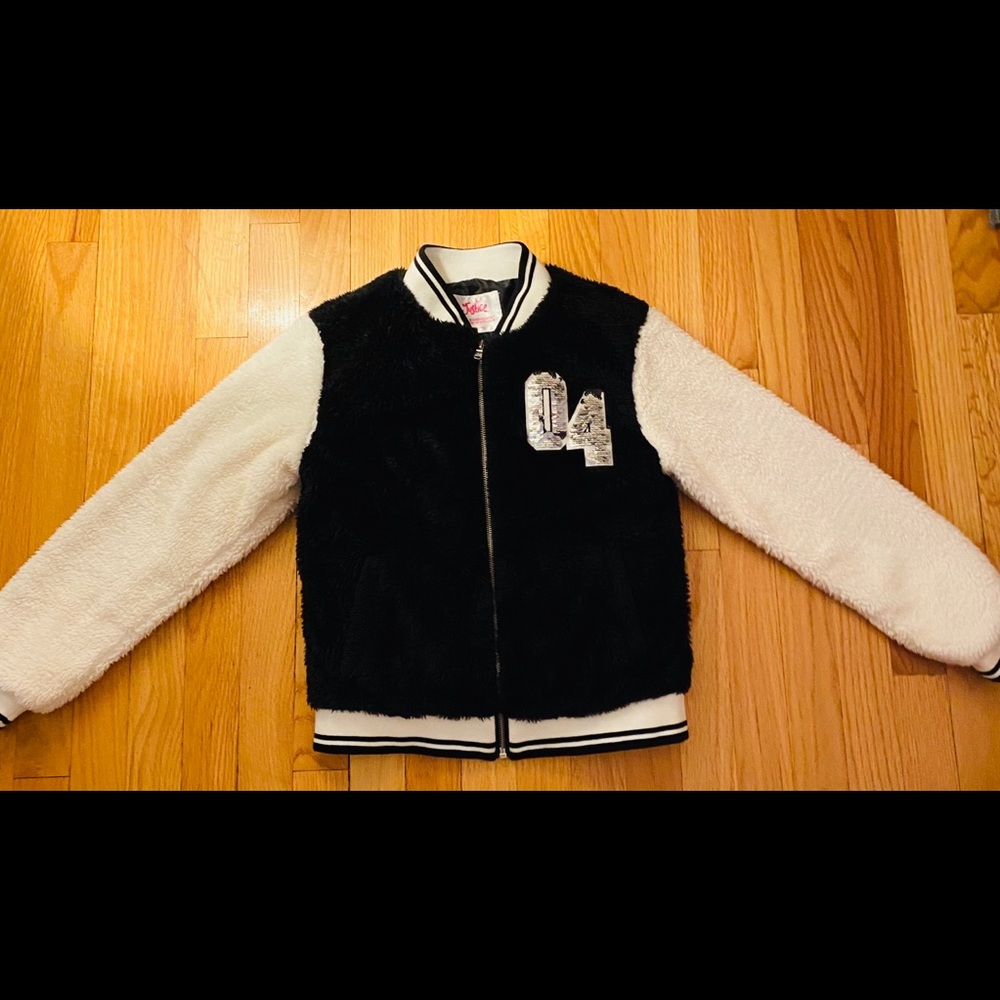 A black and white  fluff jacket